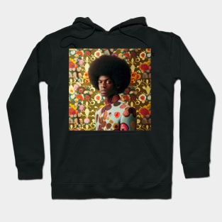 Man with an afro standing in front of a floral wallpaper Hoodie